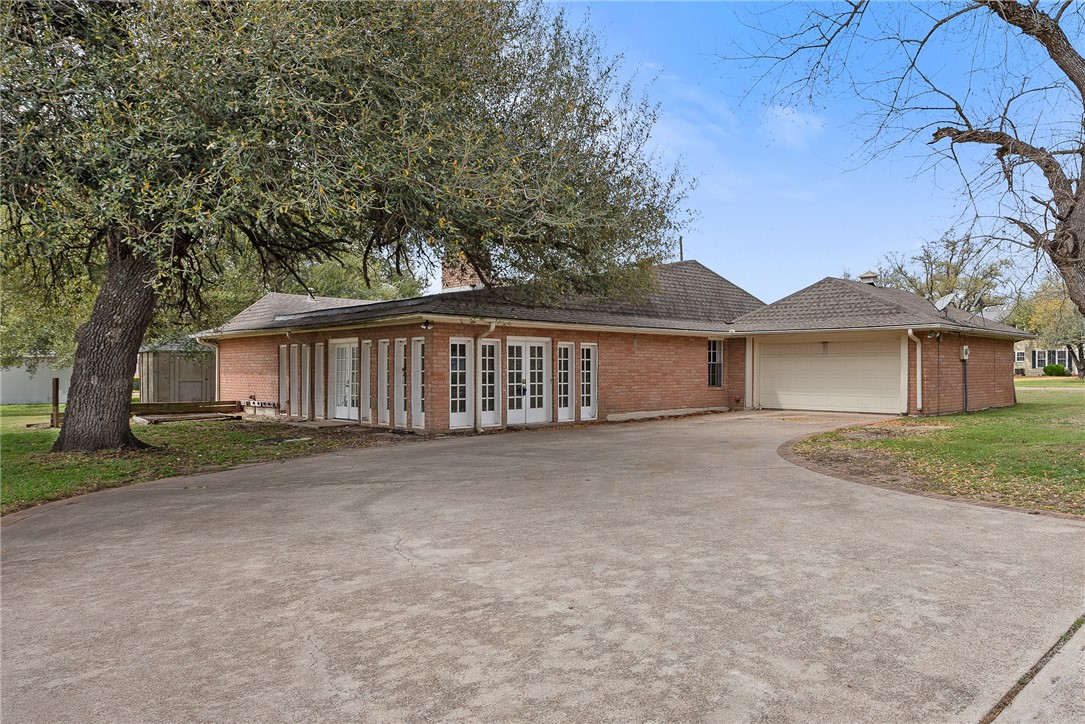 608 Barton Street Calvert, TX 77837 - Photo 15 of 16 a view of a house with a yard and large tree