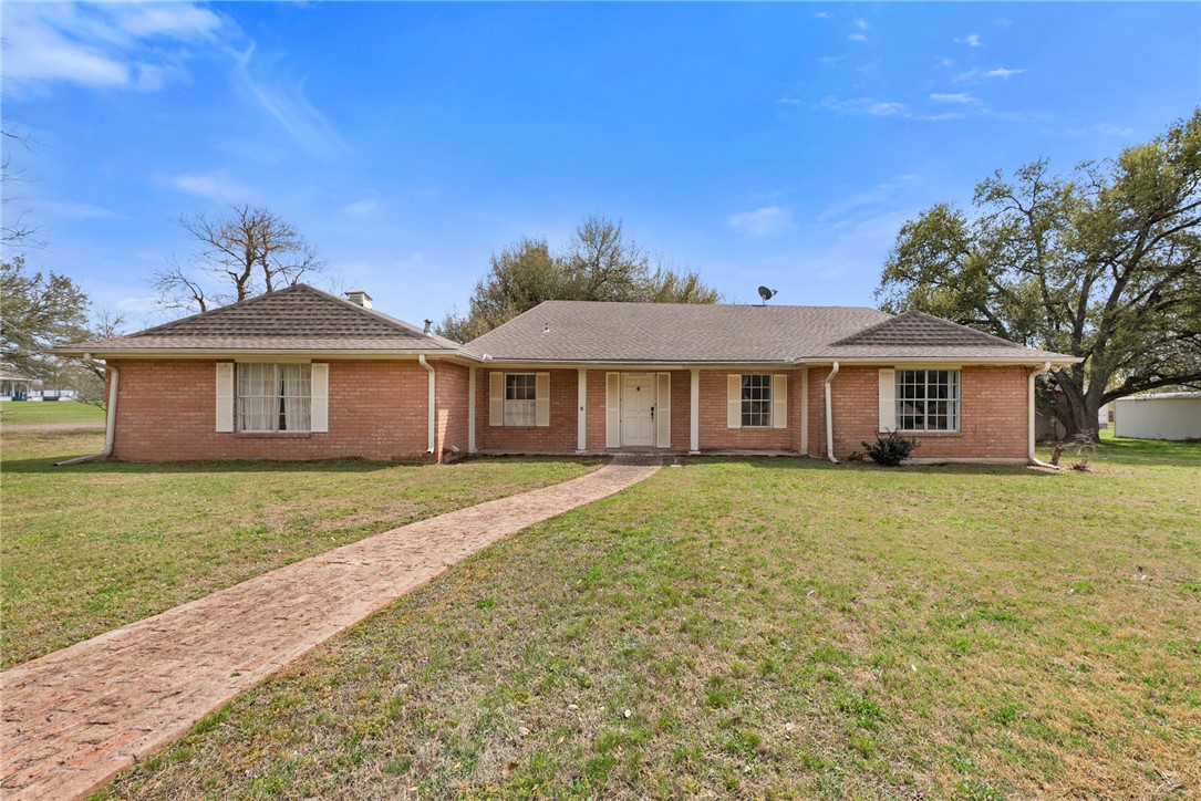 608 Barton Street Calvert, TX 77837 - Photo 2 of 16 a front view of a house with a garden