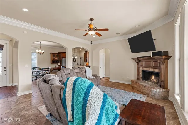 a living room with furniture fireplace and flat screen tv