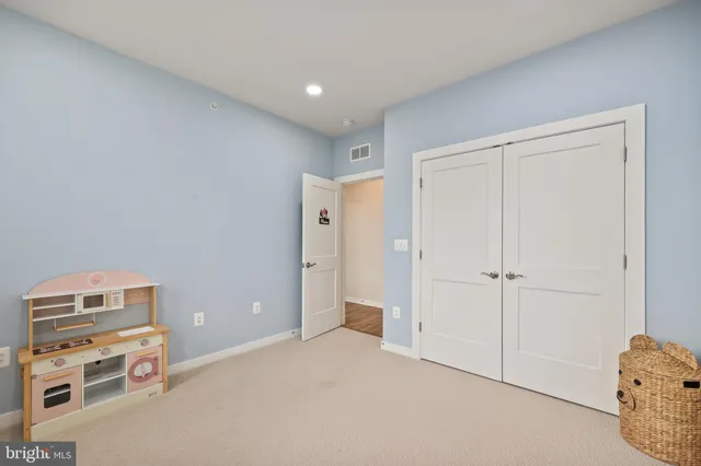 a view of room with cabinet and closet