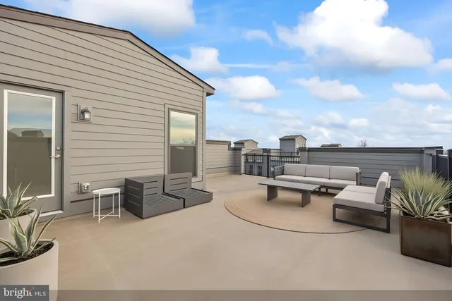 a view of a terrace with furniture