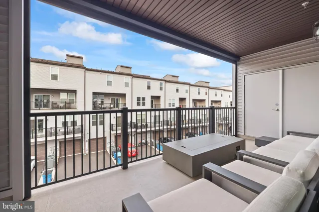 a front view of residential houses with outdoor space