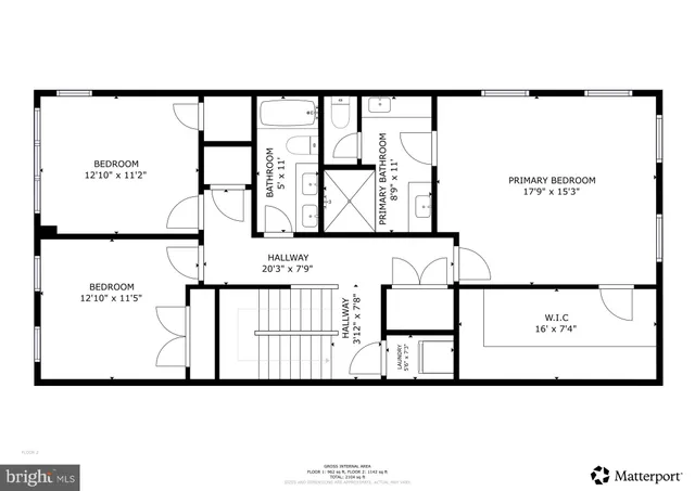 a garden view with a sitting space and trees