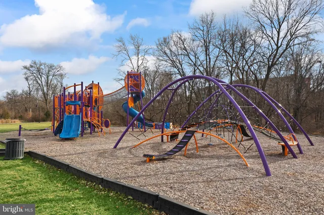 a view of a playground with houses