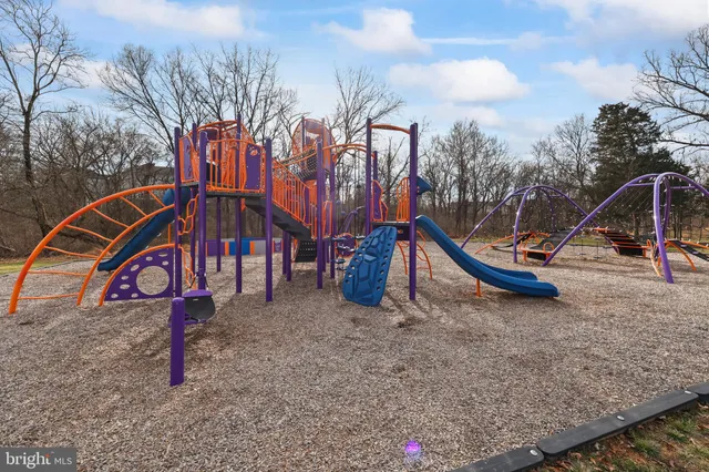 a childrens park with lots of trees