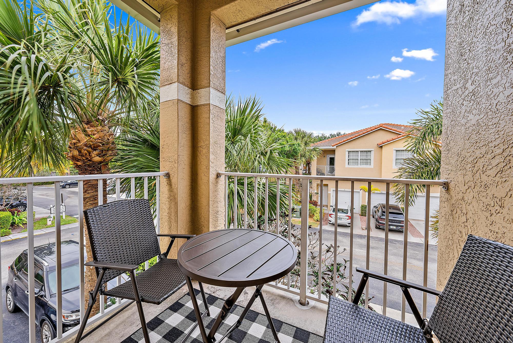 105 Lighthouse Circle, Unit J Tequesta, FL 33469 - Photo 12 of 18 a view of a chairs in balcony