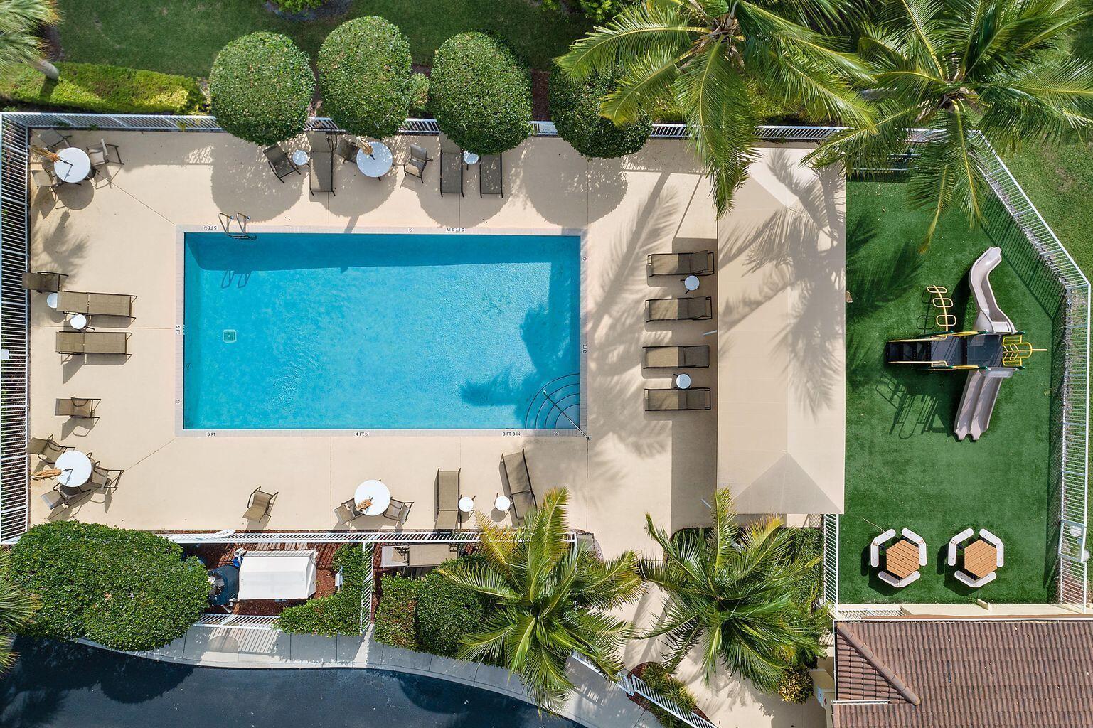 105 Lighthouse Circle, Unit J Tequesta, FL 33469 - Photo 17 of 18 a view of outdoor space and seating area