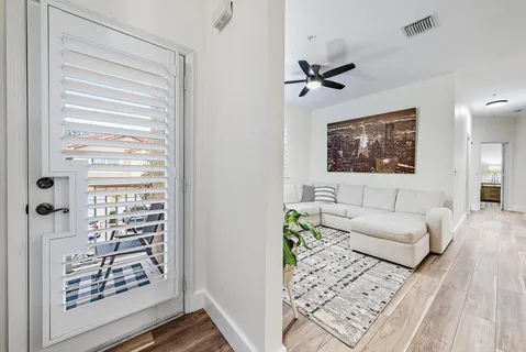 a living room with furniture and a window