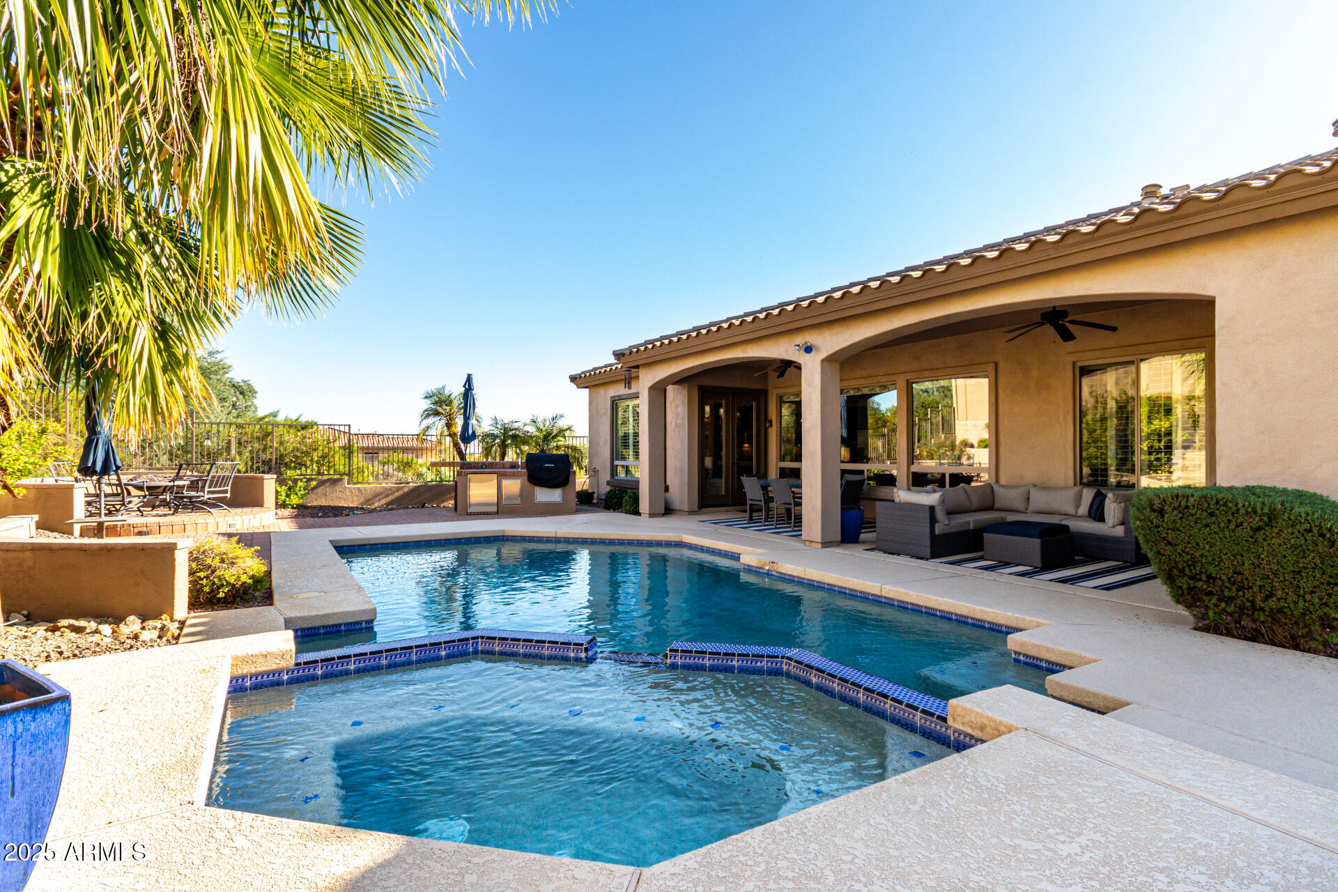a view of a swimming pool with chairs
