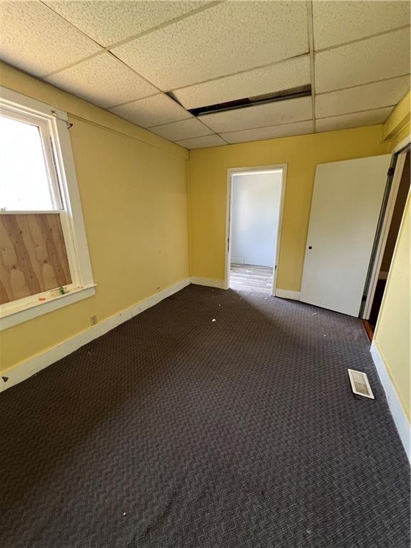 1109 Mccomb Lane Pittsburgh, PA 15239 - Photo 13 of 41 a view of a room that has wooden floor and a window