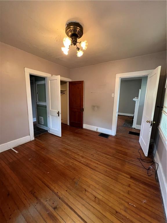 1109 Mccomb Lane Pittsburgh, PA 15239 - Photo 16 of 41 wooden floor in an empty room with a mirror