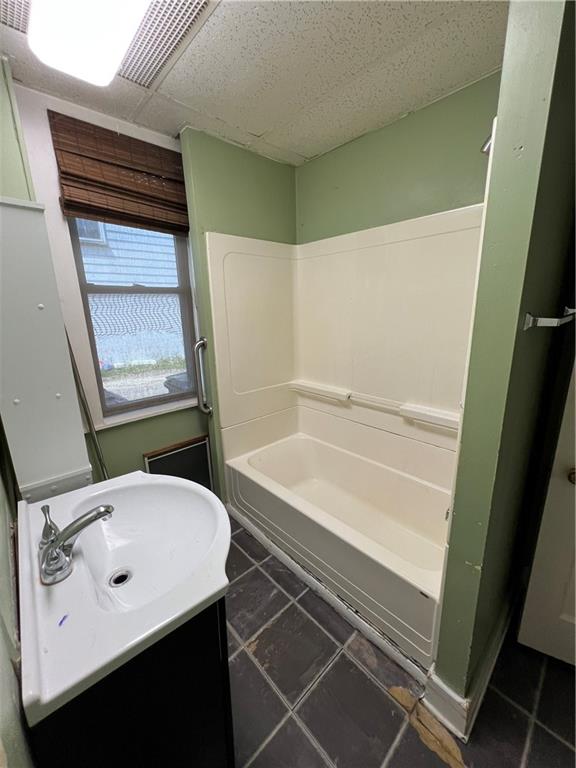 1109 Mccomb Lane Pittsburgh, PA 15239 - Photo 17 of 41 a bathroom with a sink a toilet and shower