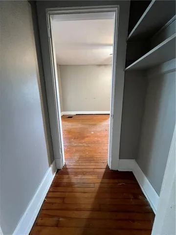a view of balcony with wooden floor