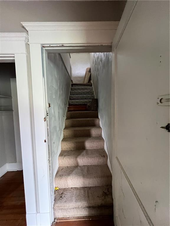 1109 Mccomb Lane Pittsburgh, PA 15239 - Photo 20 of 41 a view of staircase with white walls and a window