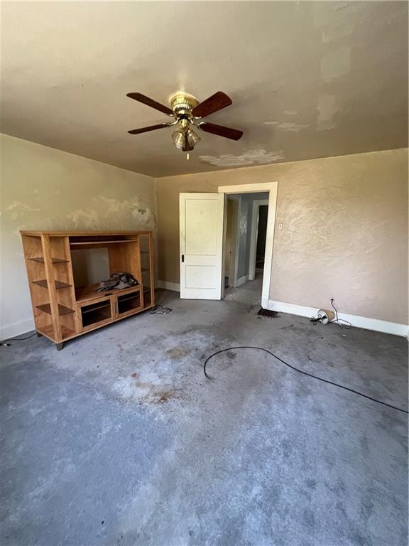 1109 Mccomb Lane Pittsburgh, PA 15239 - Photo 24 of 41 a view of an empty room with furniture and a ceiling fan
