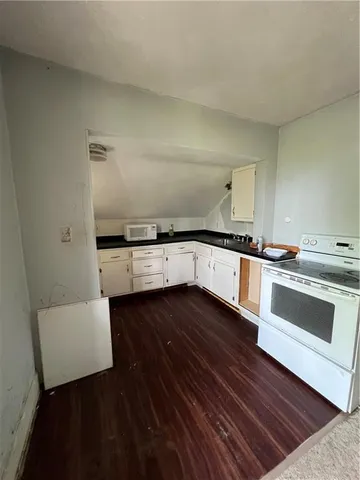 a view of a kitchen with electric appliances