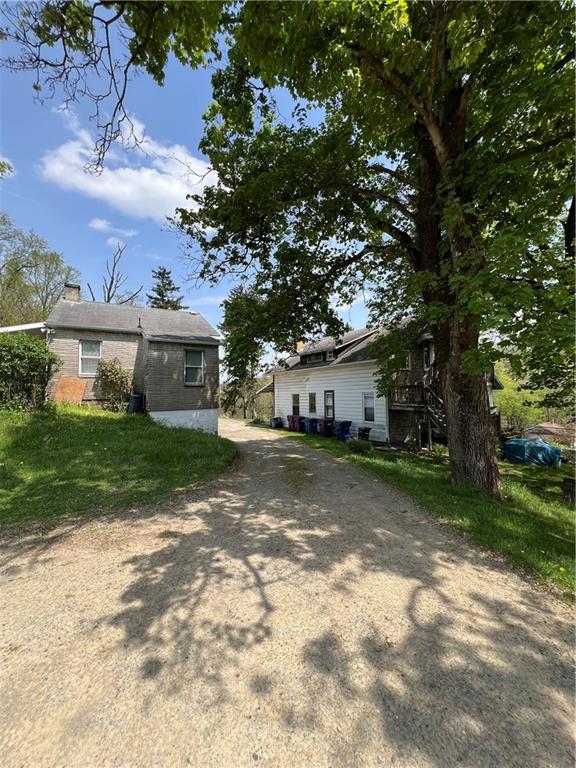 1109 Mccomb Lane Pittsburgh, PA 15239 - Photo 37 of 41 a view of a house with a yard