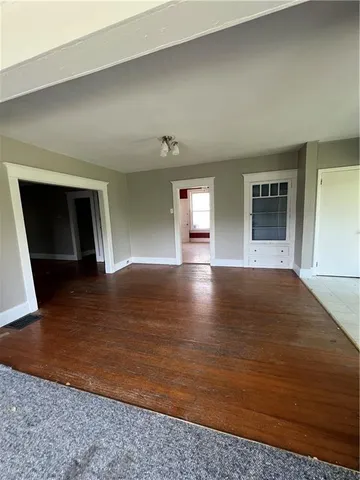 a kitchen with a stove a sink dishwasher and a refrigerator