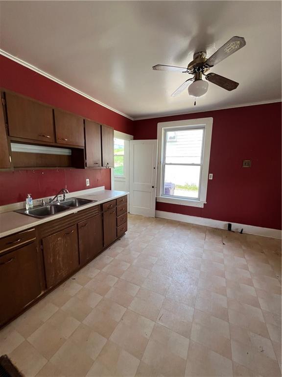 1109 Mccomb Lane Pittsburgh, PA 15239 - Photo 8 of 41 a kitchen with a stove a sink dishwasher and a refrigerator