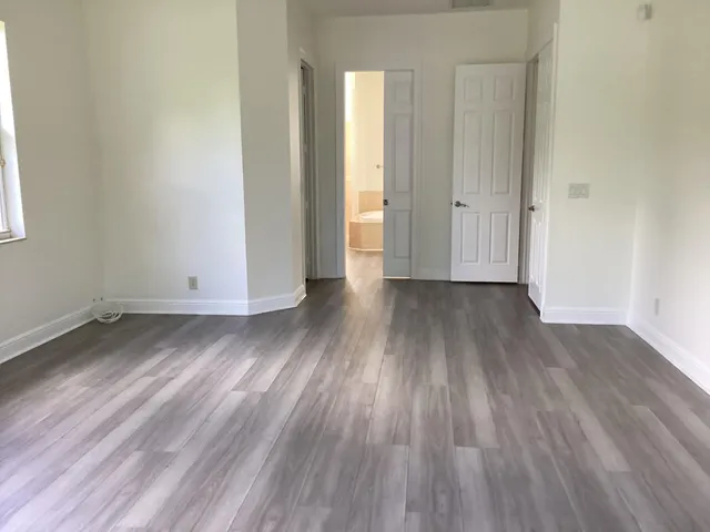 a bathroom with a bathtub and a window