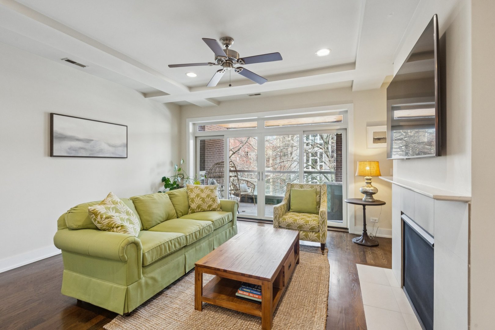 1011 North Wolcott Avenue, Unit 2N Chicago, IL 60622 - Photo 3 of 23 a living room with furniture and a fireplace
