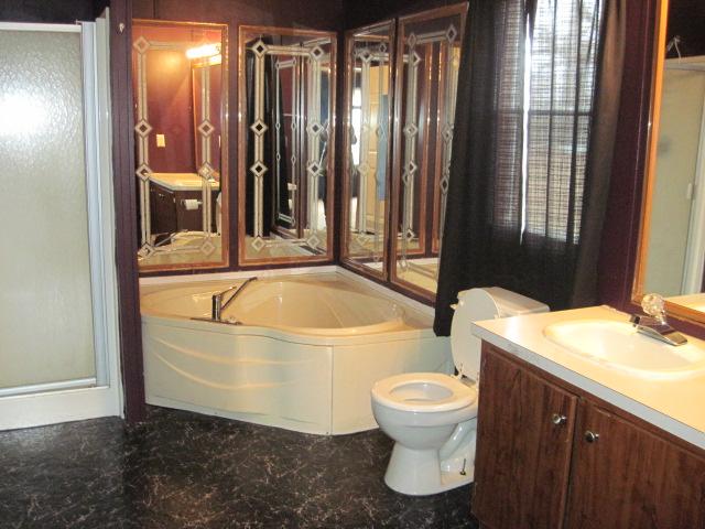 7398 King Road Fairview, TN 37062 - Photo 12 of 19 a bathroom with a sink toilet and shower