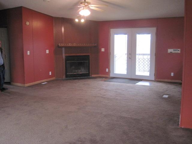 7398 King Road Fairview, TN 37062 - Photo 8 of 19 an empty room with windows and fireplace