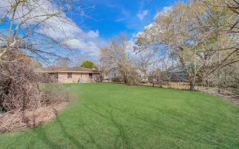 a view of a house with a back yard