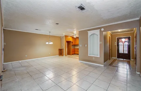 a view of a hallway with wooden shelves