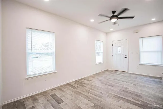 a view of an empty room with a window