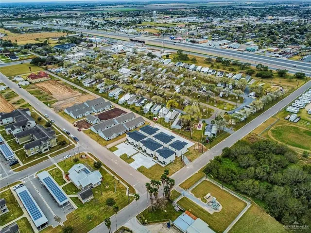 an aerial view of a residential apartment building with a lake view