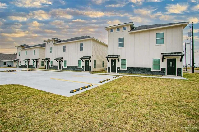 a swimming pool with outdoor seating and yard
