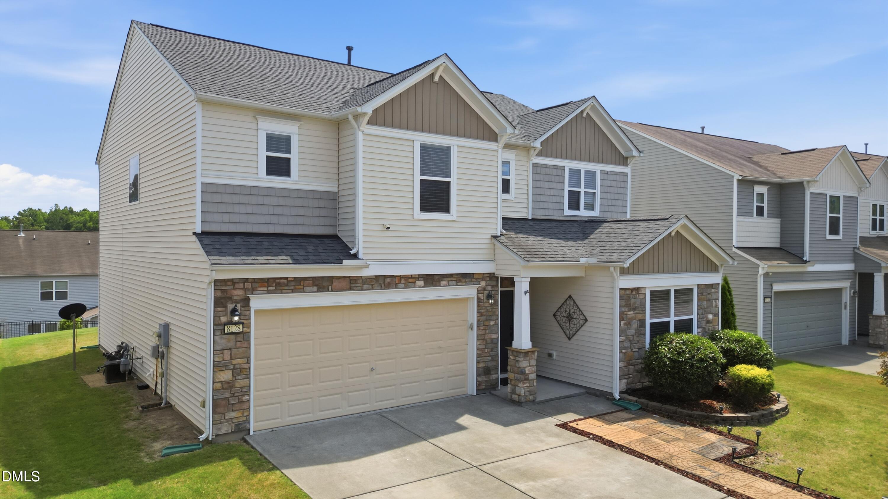 8128 Hovingham Way Raleigh, NC 27616 - Photo 28 of 40 a front view of a house with a garden