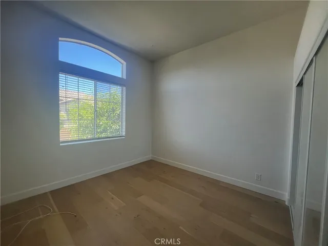an empty room with closet area