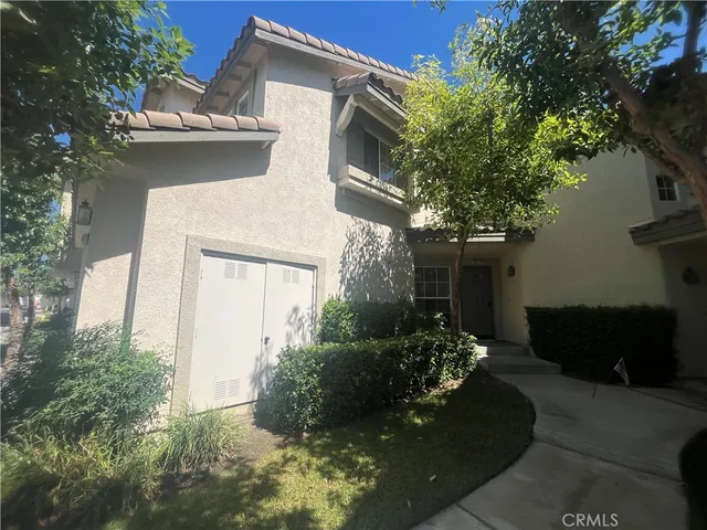 an aerial view of a house with outdoor space