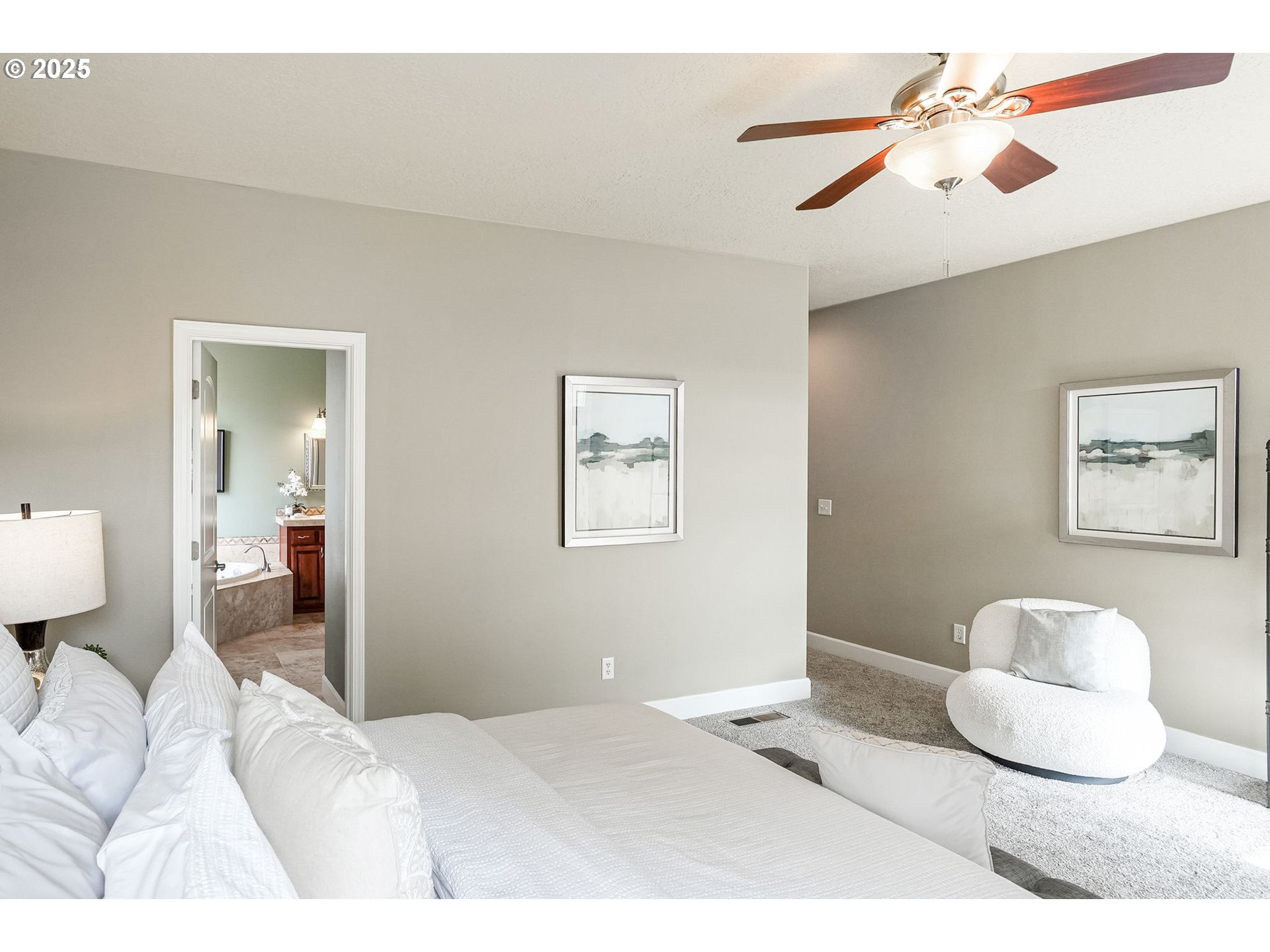 413 Northwest Harold Street Sublimity, OR 97385 - Photo 23 of 48 a bedroom with a bed and a chandelier