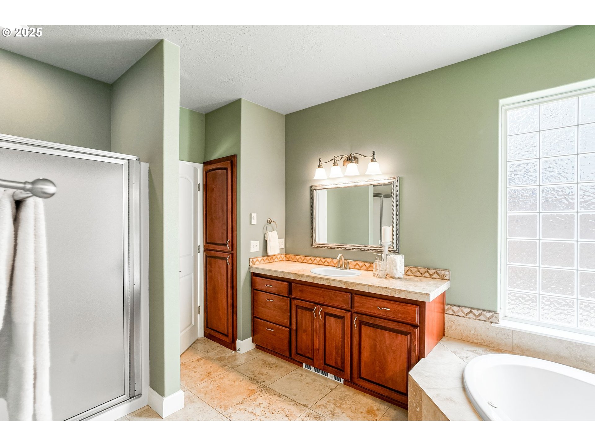 413 Northwest Harold Street Sublimity, OR 97385 - Photo 25 of 48 a bathroom with a tub sink shower and mirror