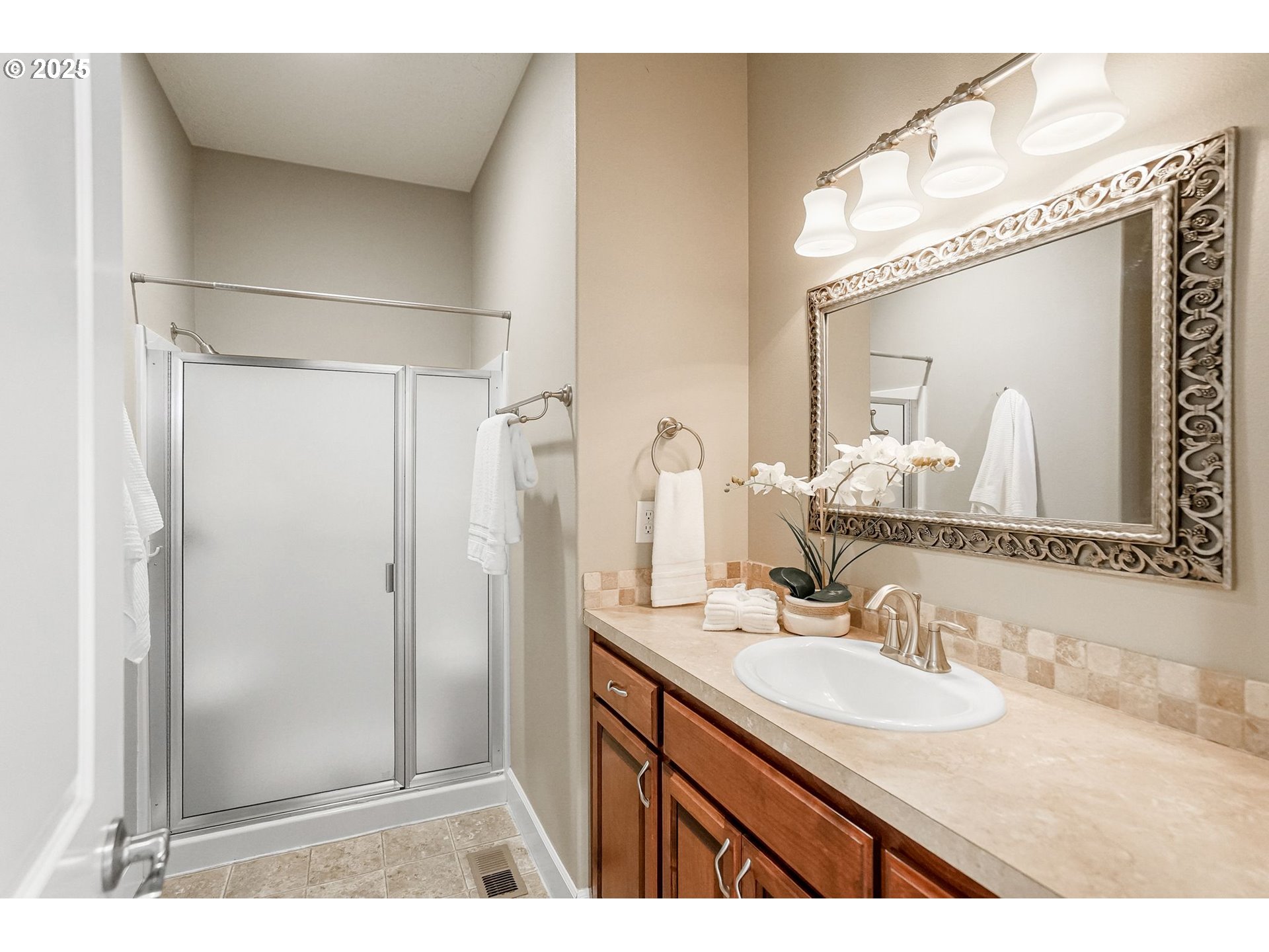 413 Northwest Harold Street Sublimity, OR 97385 - Photo 28 of 48 a bathroom with a granite countertop sink mirror and a