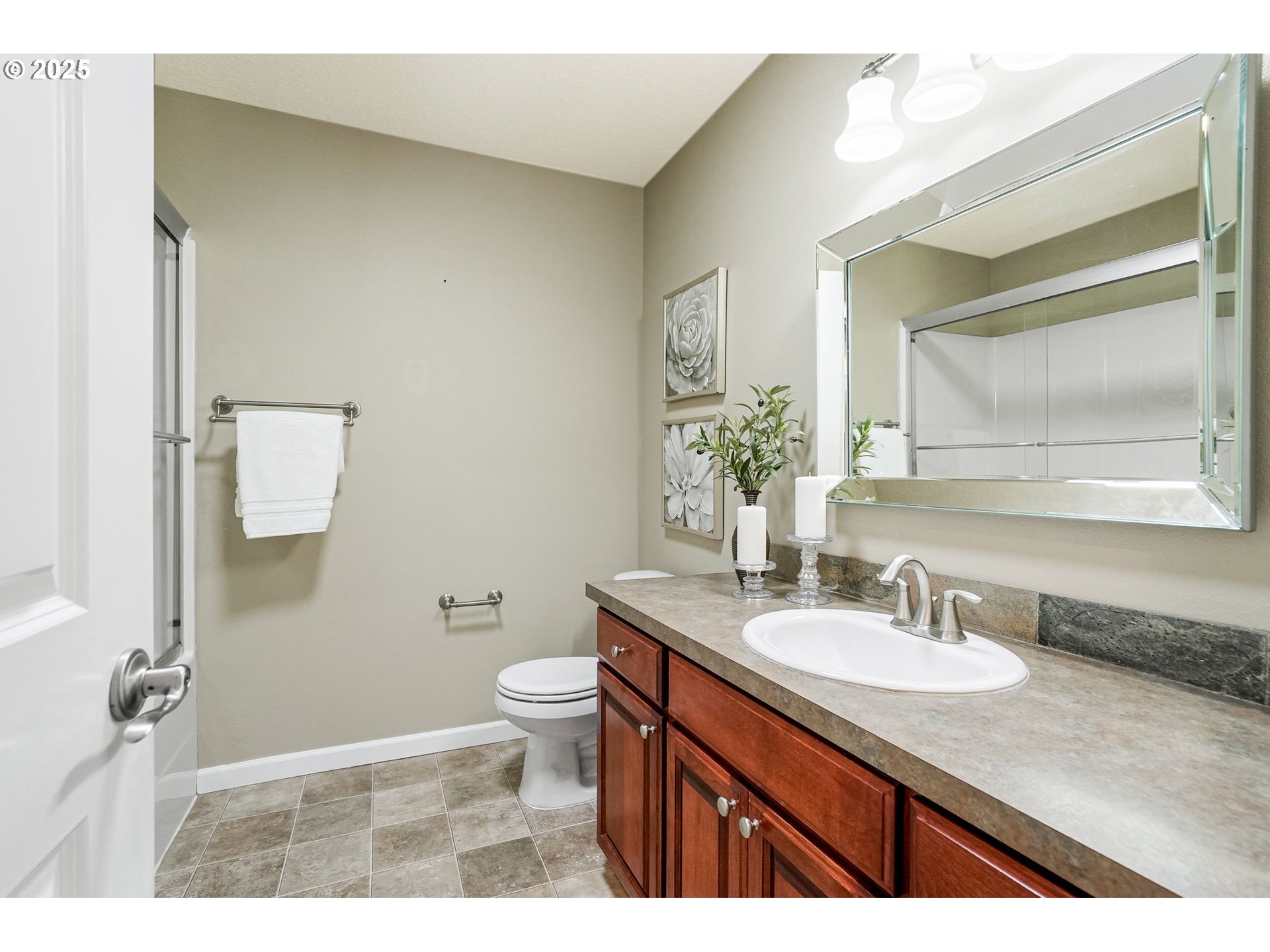 413 Northwest Harold Street Sublimity, OR 97385 - Photo 33 of 48 a bathroom with a granite countertop sink toilet and mirror