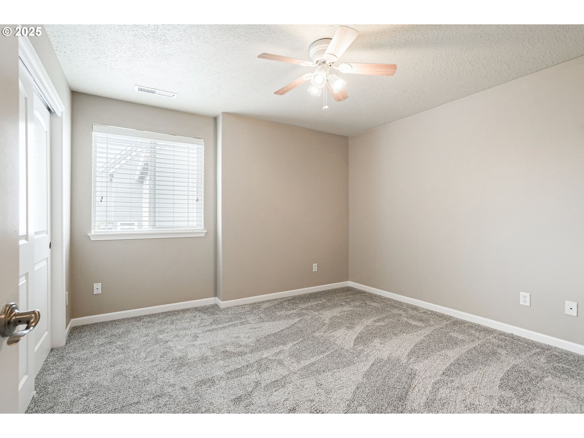 413 Northwest Harold Street Sublimity, OR 97385 - Photo 35 of 48 an empty room with windows and chandelier fan