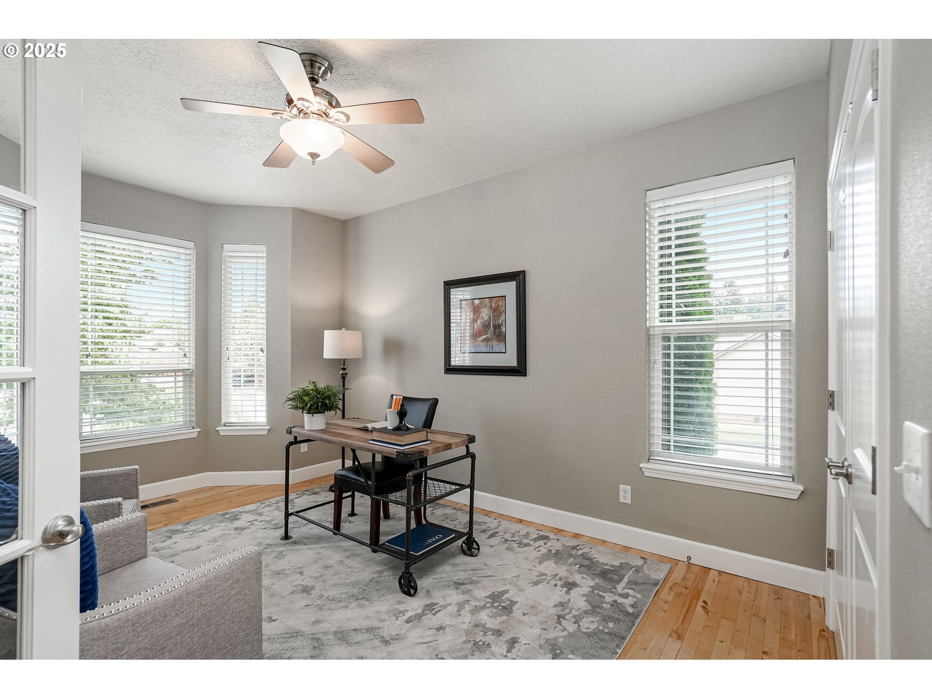 413 Northwest Harold Street Sublimity, OR 97385 - Photo 6 of 48 a living room with furniture and a large window