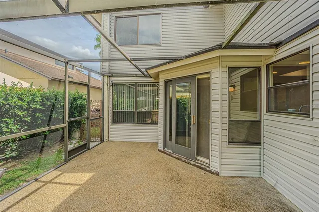 a view of a swimming pool with a patio