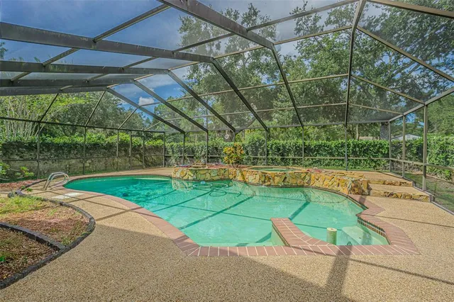 a view of a swimming pool with a patio