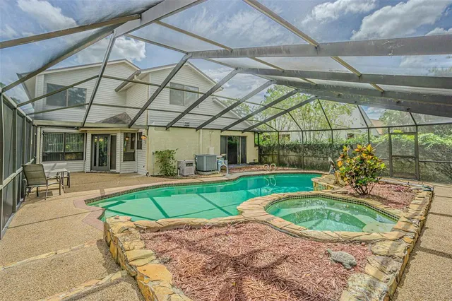 a view of a swimming pool with a patio