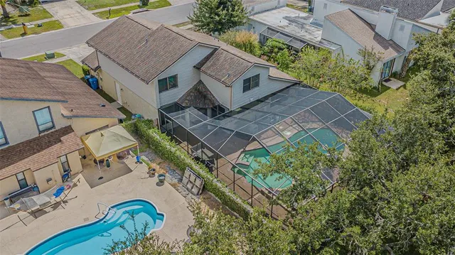 aerial view of a house with a yard