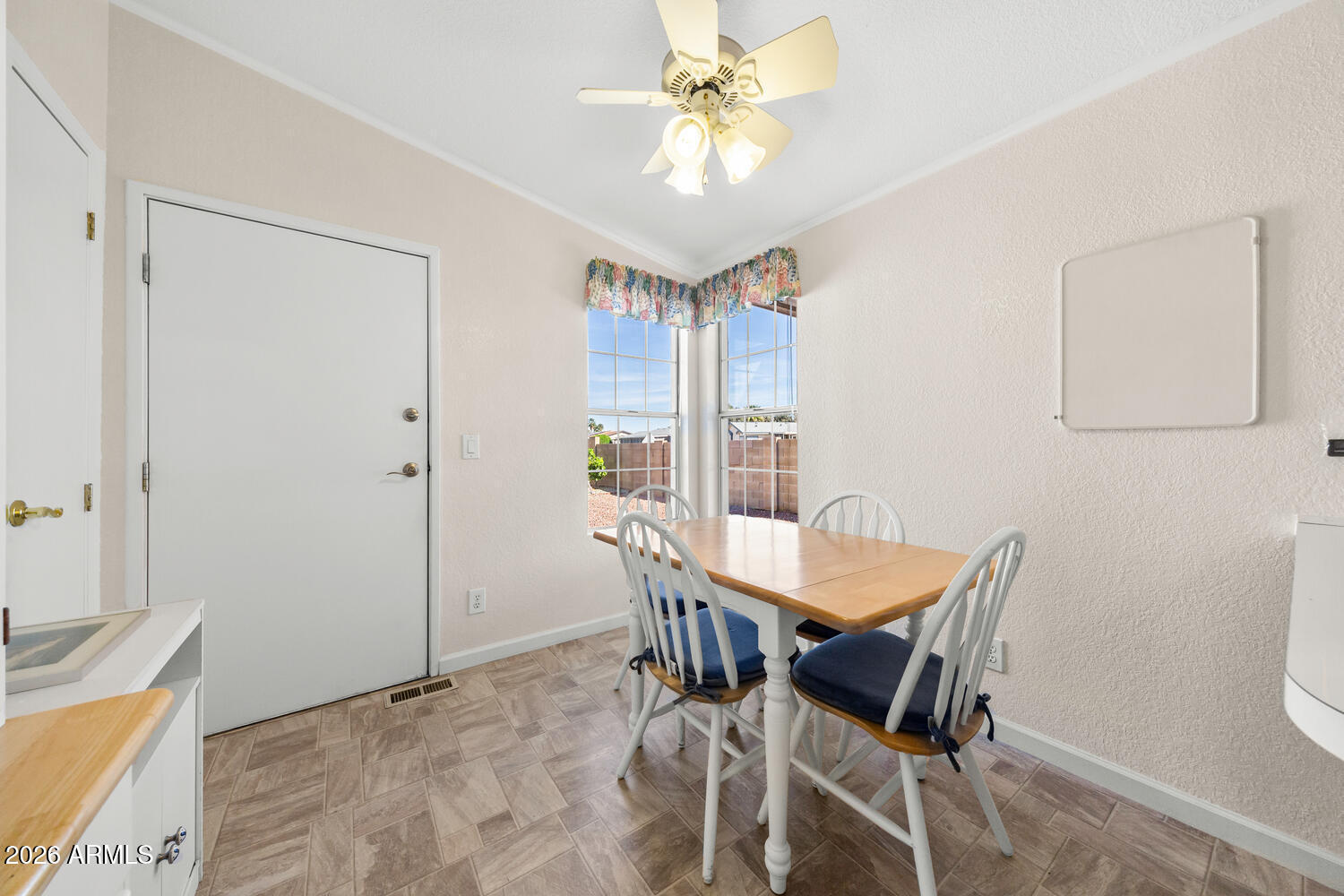 17200 West Bell Road, Unit 2251 Surprise, AZ 85374 - Photo 11 of 35 a view of a dining room with furniture and a chandelier