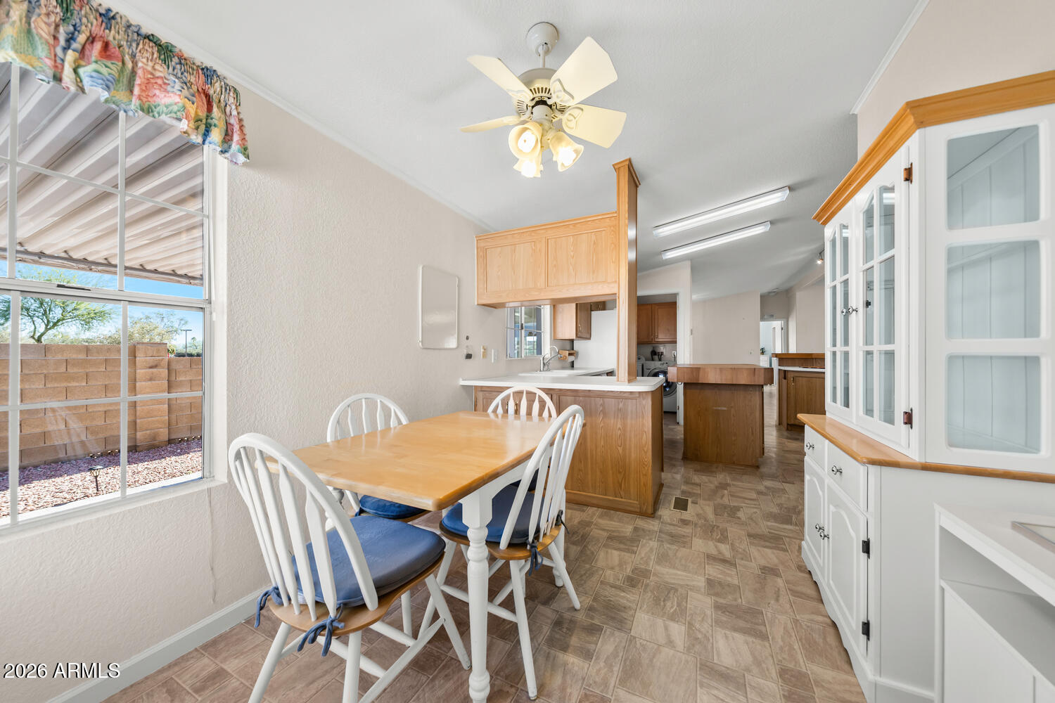 17200 West Bell Road, Unit 2251 Surprise, AZ 85374 - Photo 12 of 35 a view of a dining room with furniture and a chandelier