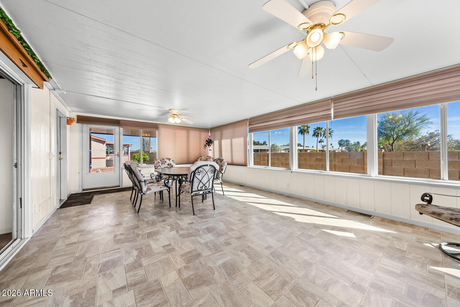 17200 West Bell Road, Unit 2251 Surprise, AZ 85374 - Photo 16 of 35 a view of a dining room with furniture window and outside view