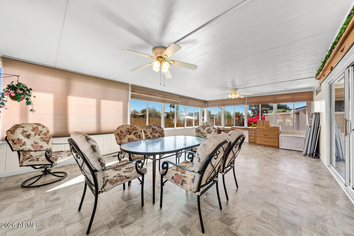 17200 West Bell Road, Unit 2251 Surprise, AZ 85374 - Photo 18 of 35 a view of a dining room with furniture and a chandelier