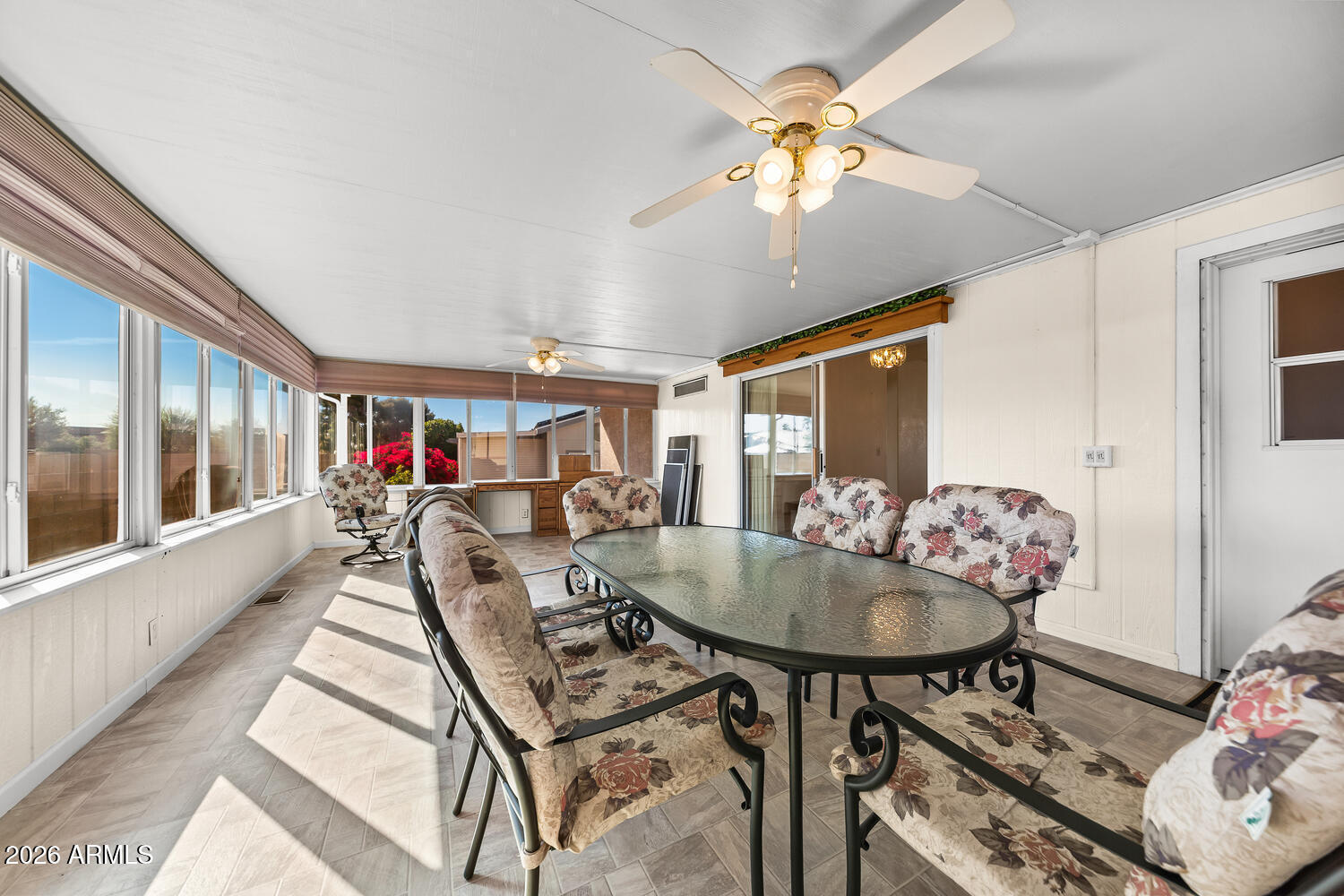 17200 West Bell Road, Unit 2251 Surprise, AZ 85374 - Photo 19 of 35 a living room with furniture and a chandelier